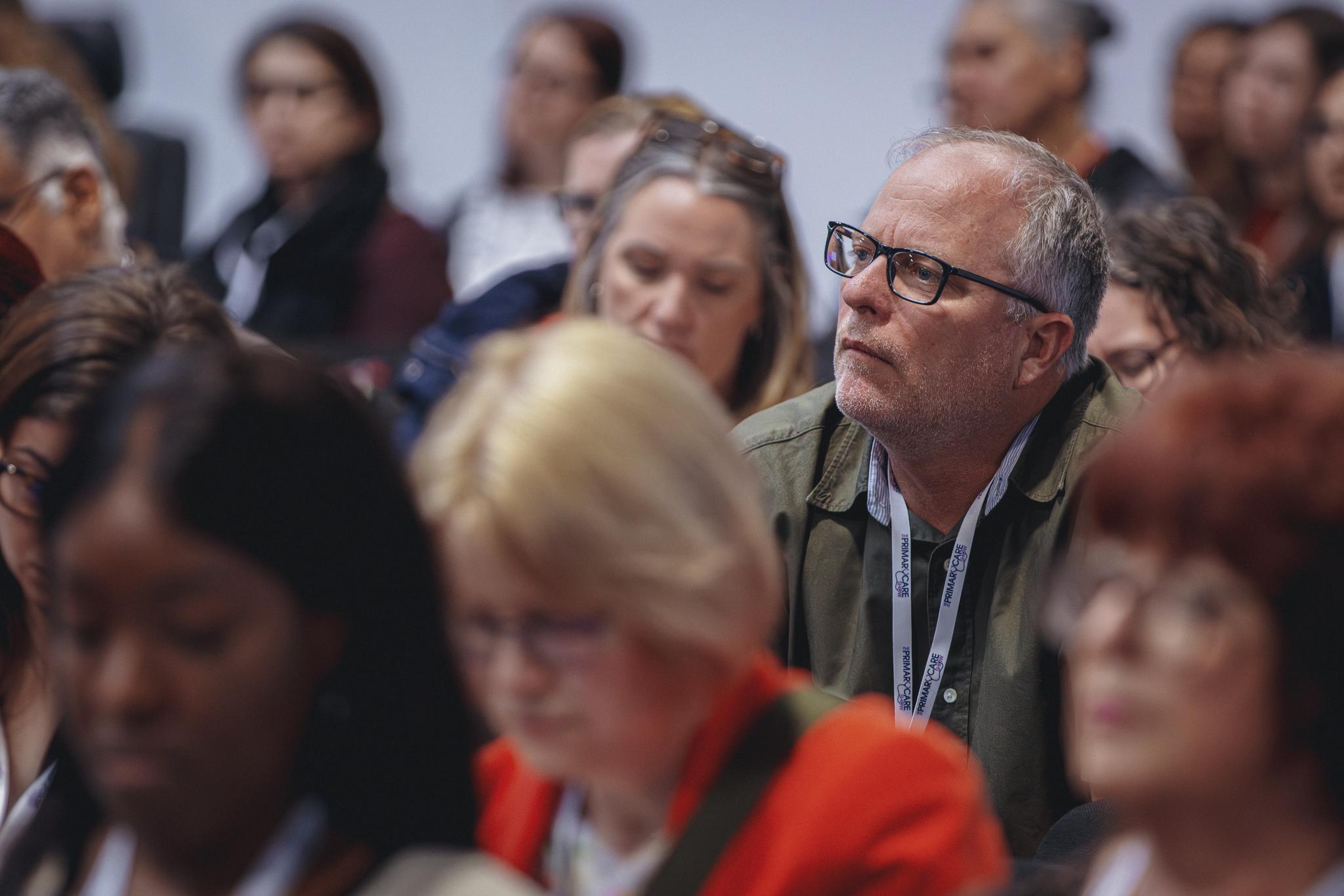 Healthcare professional attending an educational conference session