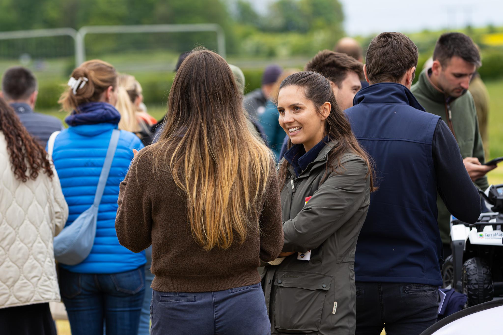 visitors talking at an agricultural event