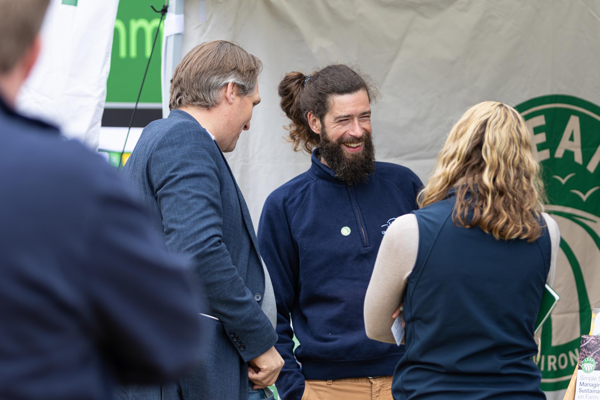Visitors chatting at an agricultural event
