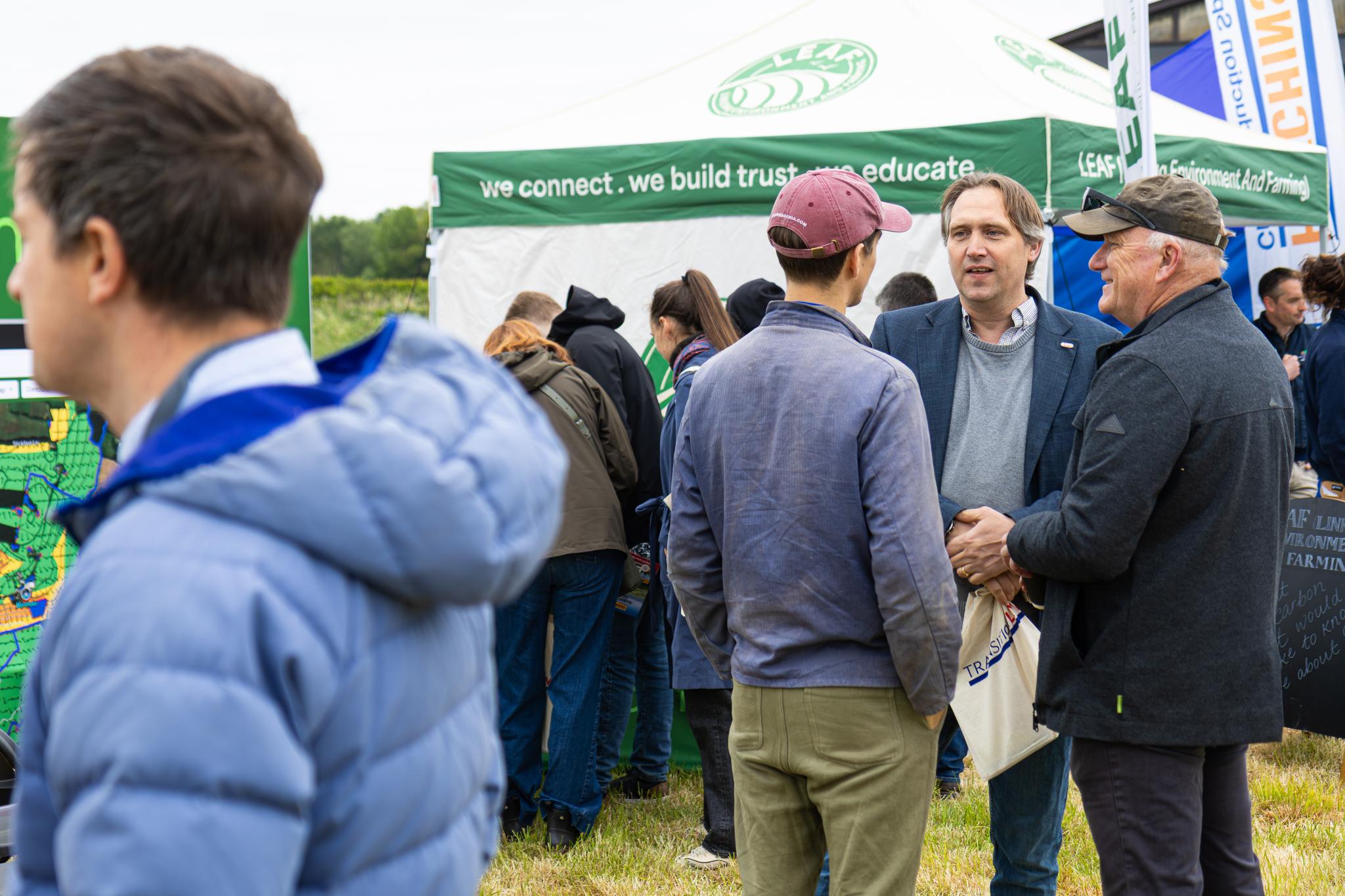 Farmers networking at an agricultural event