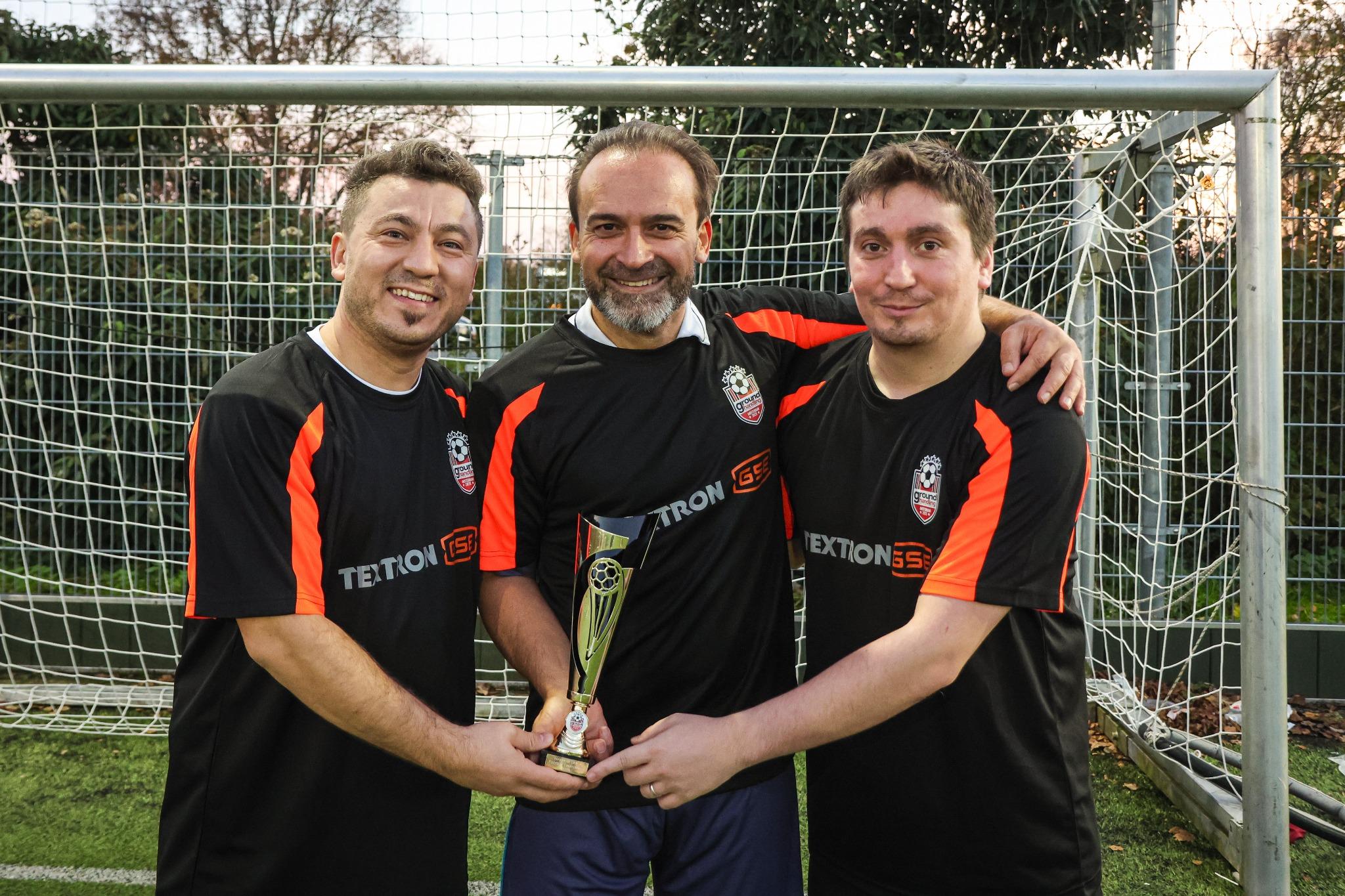 GHI Annual football ball and trophy