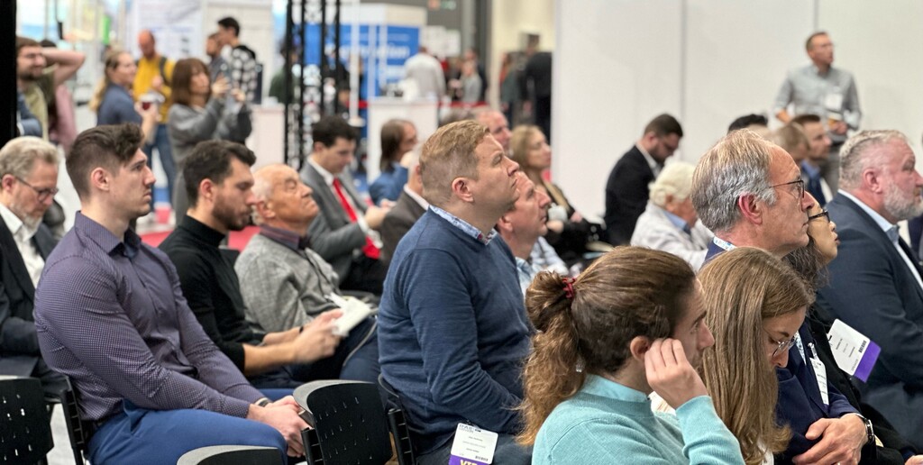 Delegates listening to a conference session