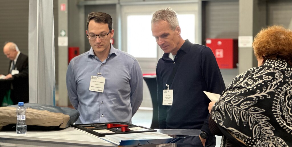 Exhibitors demonstrating rail interior components
