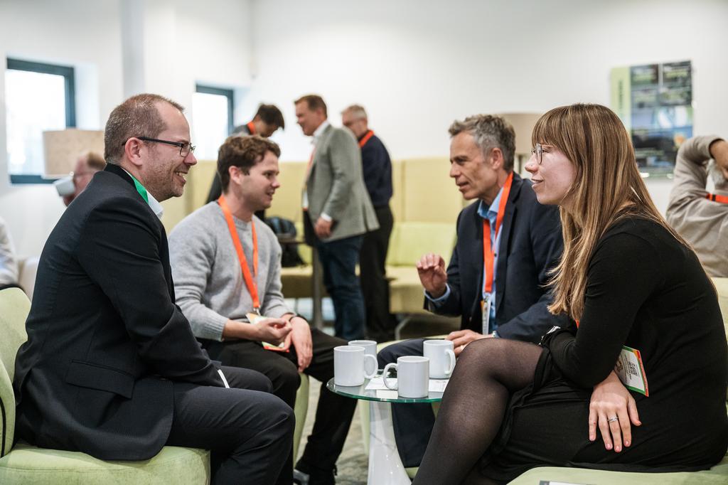 Delegates gathering around in discussion