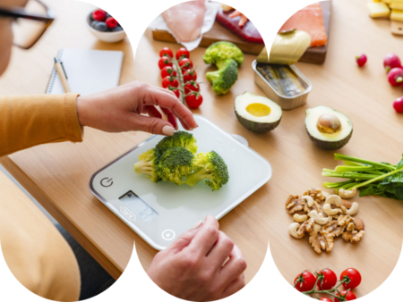 Woman lifting delicious steaming hot ramen noodles with chopsticks