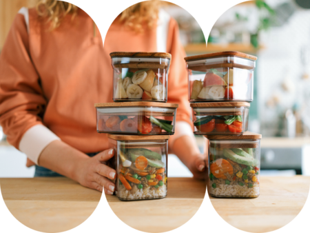 Woman lifting delicious steaming hot ramen noodles with chopsticks