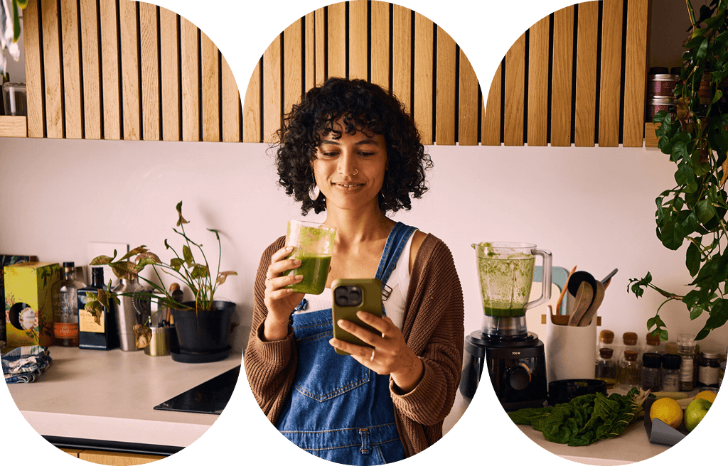 A young adult woman at home drinking a nutritious green smoothie