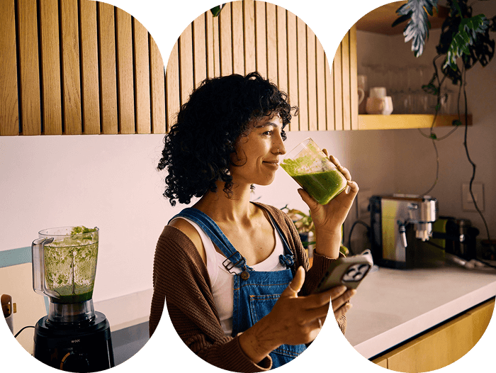 A Young Nutritionist at Home Drinking a Nutritious Smoothie